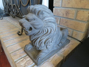 Asian lion keeping things under control on the fireplace.