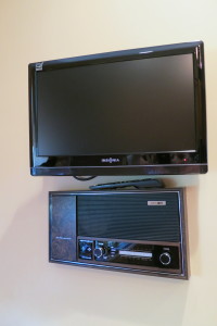 A bit of the old and new. A 1980s intercom and sound system is almost as big as a flat screen TV.