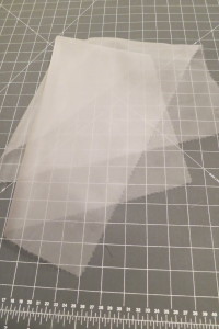 Organza makes a great pressing cloth. Use pinking sheers to cut the edge in order to prevent fraying.