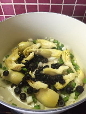 Add the black olives and artichokes, cooking until softened. 