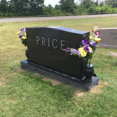 My parents grave marker. My sister adds new flowers each homecoming, as well as on all major holidays.