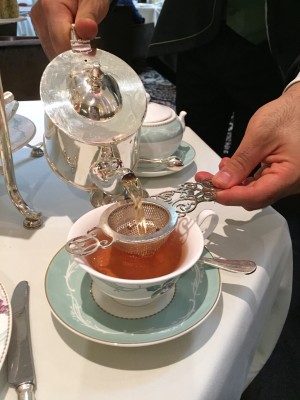 Tea being poured by a waiter at The Savoy.