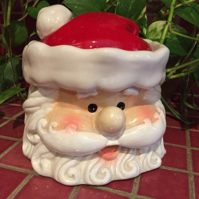 A Santa jar keeps a watchful eye for naughty and nice behaviors.
