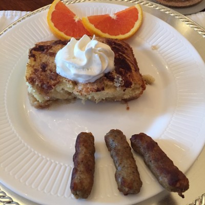 Apple streusel baked pancake with sausage and blood orange slices.