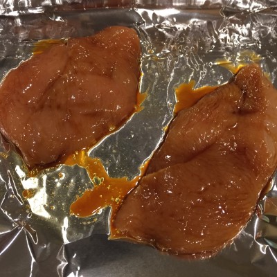 Put the marinated chicken breasts on a foil covered pan doused with a little olive oil.