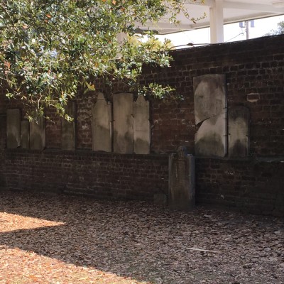 The back wall at Colonial Park Cemetery holds broken headstones. The headstones were broken by Union soldiers' horses.
