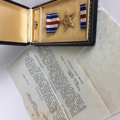 Granddad's Silver Star Citation and the replacement Silver Star metal.