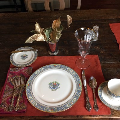 This place setting indicates bread and butter, salad, soup and an entree will be served. Dessert utensils will be served with the dessert, and a spoon for the coffee will be served with the coffee.
