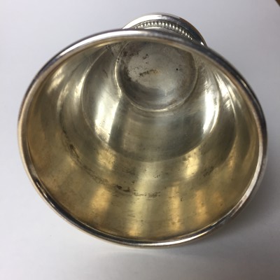 The inside of an old mint julep cup. This one should not be used for food or drink.