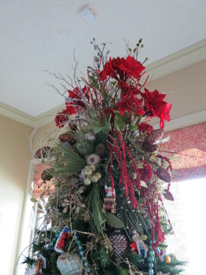 My tree topper consists of several large bunches of flowers and filler. My 7 1/2 foot tree becomes a 9 1/2 foot tree!