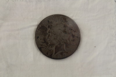 A close-up of granddaddy's lucky coin.