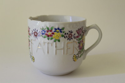Although not a shaving mug, this coffee cup or tea mug looks similarly decorated with gold and flowers.