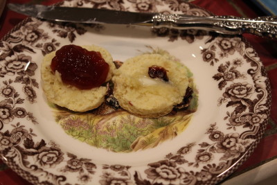 Butter and strawberry jam on a scone. Butter is not traditional; strawberry jam is very traditional.